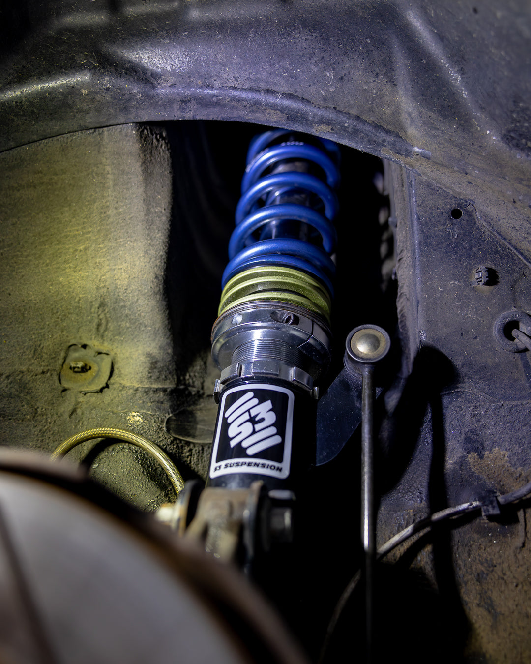 Performance coilovers installed on a lowered 1996-2000 Honda Civic EK – improved handling and stance.